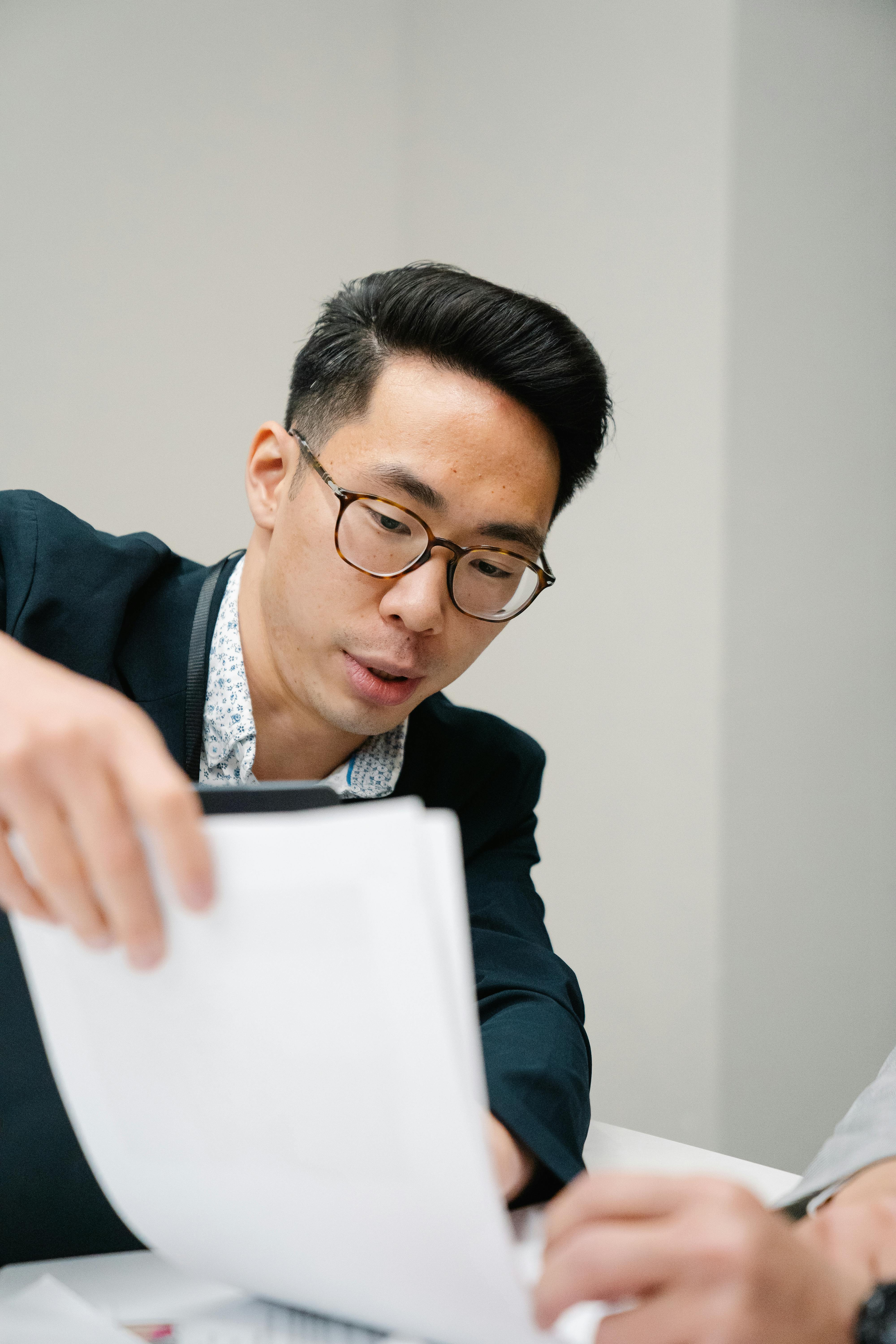 Person reviewing a job offer document